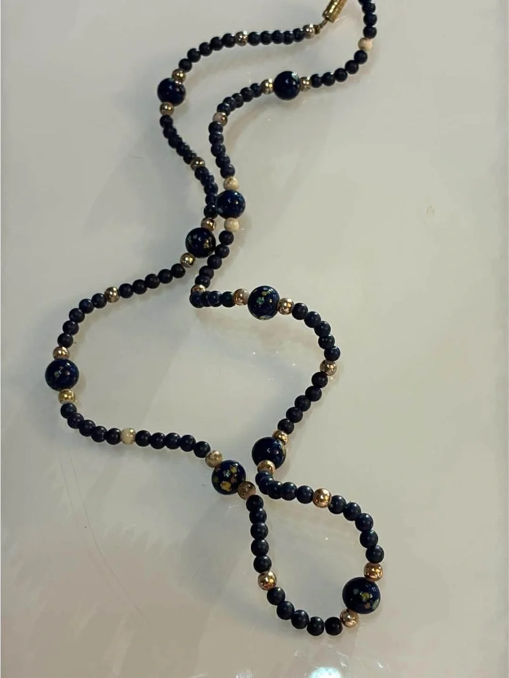Handcrafted Navy Blue Beaded Bracelet with floral Accents